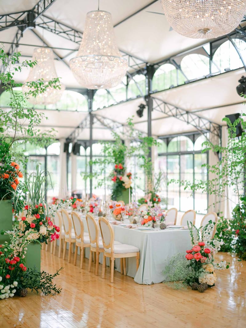 Wedding reception table setting in a garden with hydrangeas