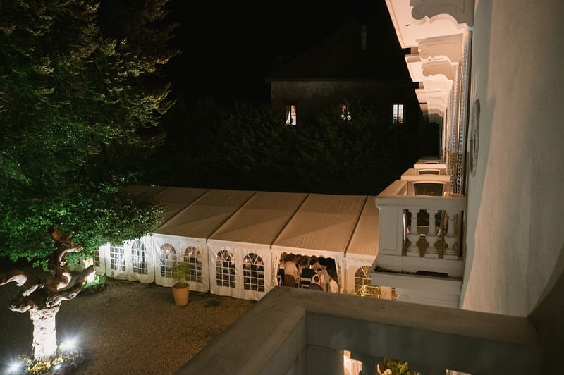 Aerial view of the lit marquee from the abbey balcony at Abbaye de Talloires