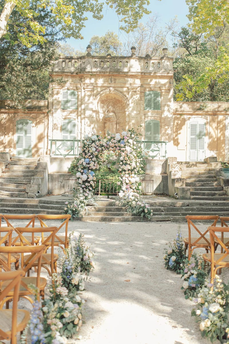 Wedding ceremony setup in a garden with white roses