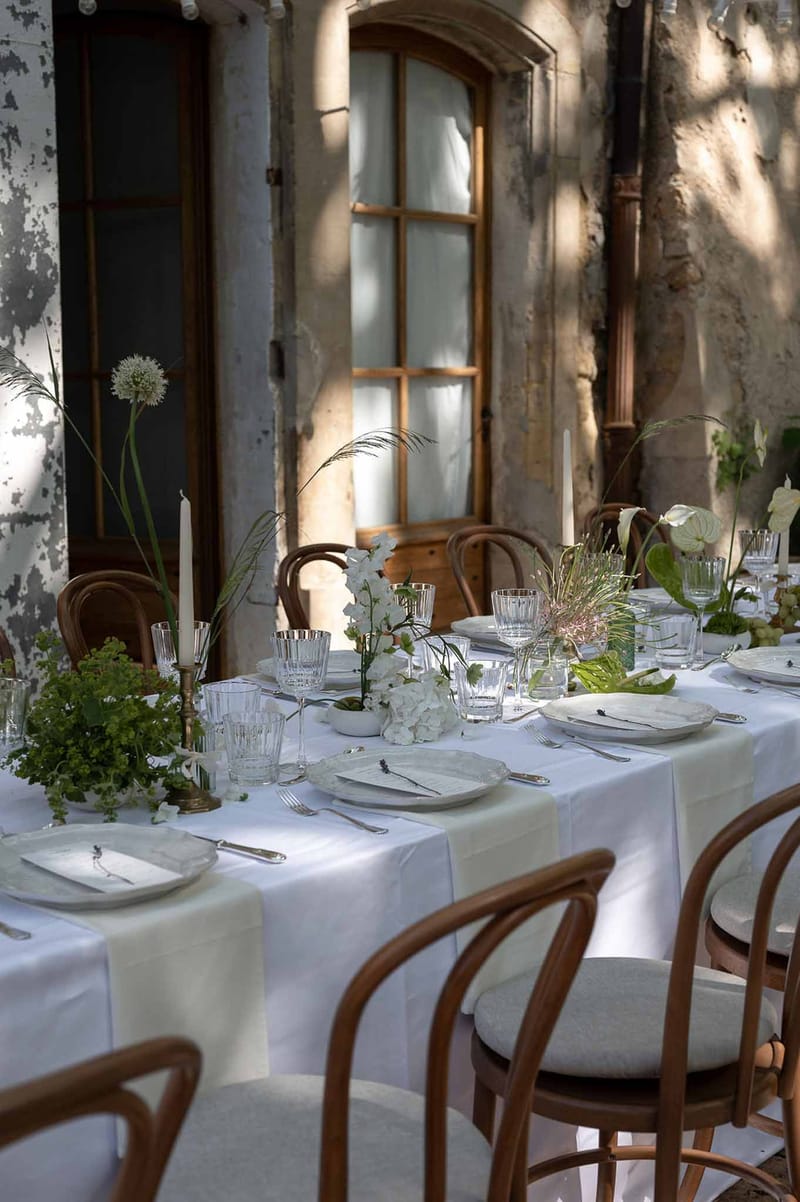 Wedding reception table setting with white roses