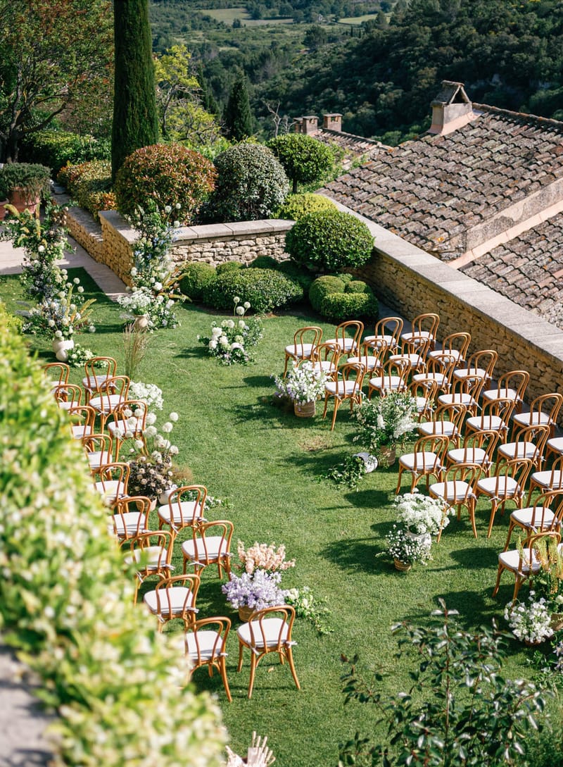 Wedding ceremony setup in a garden with white roses