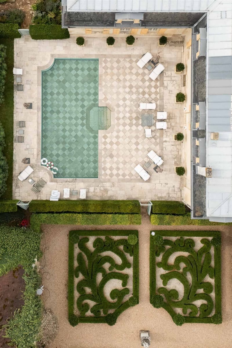 Aerial view of pool terrace and parterre gardens at Chateau de Villette