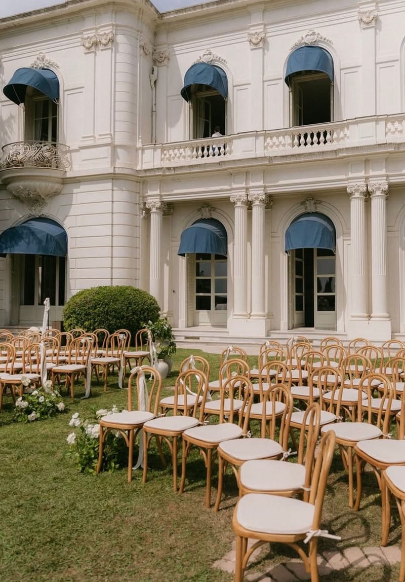 Rows of ceremony chairs on the lawn in front of the villa at Domaine Rocabella, French Riviera