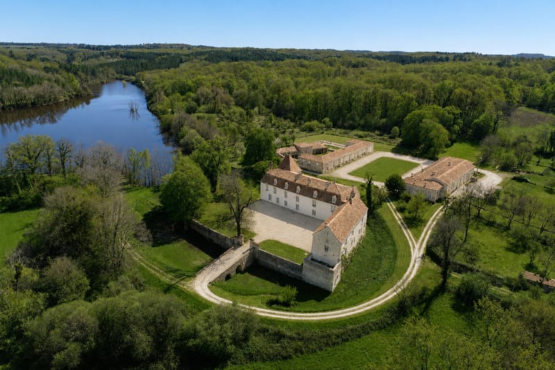 Aerial view of Château de la Faye with the lake and surrounding woodland