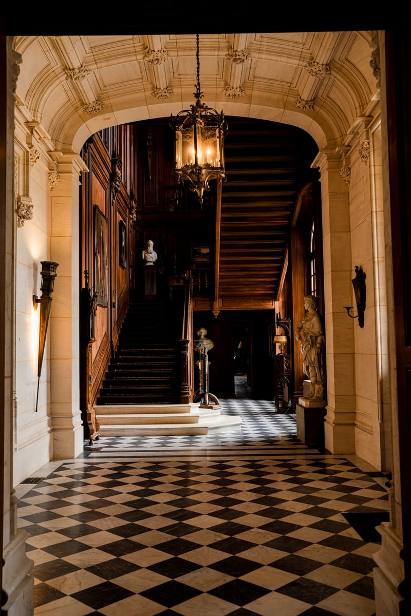 The grand staircase and entrance hall at Château Changeux