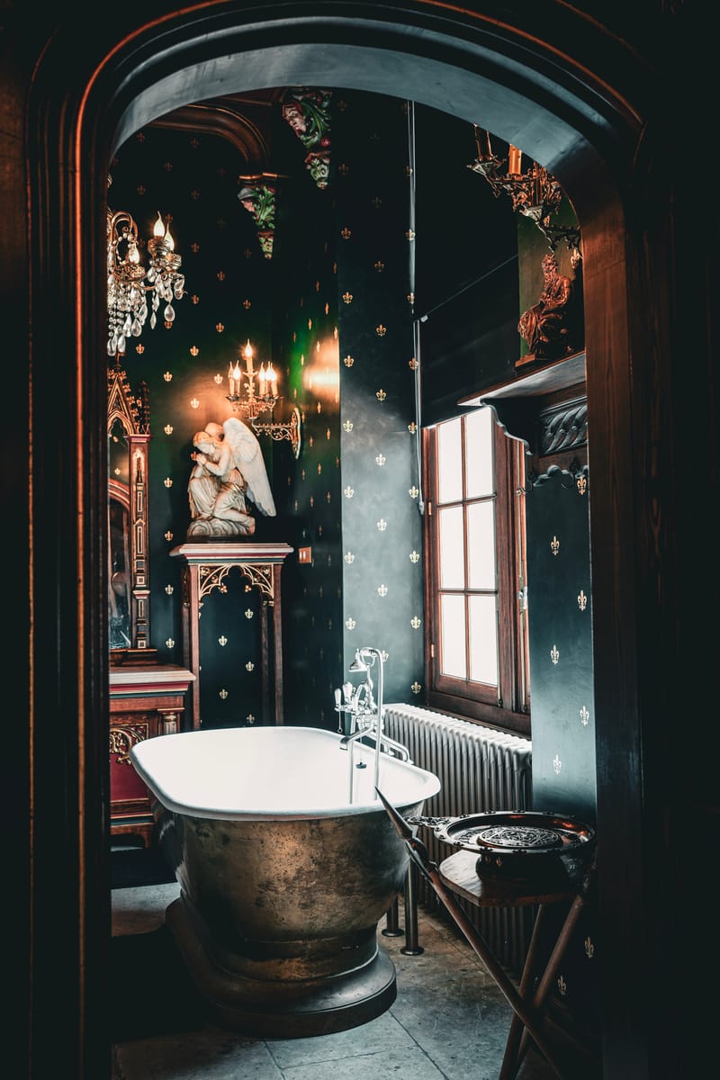 An en-suite bathroom at Château Changeux with a freestanding tub