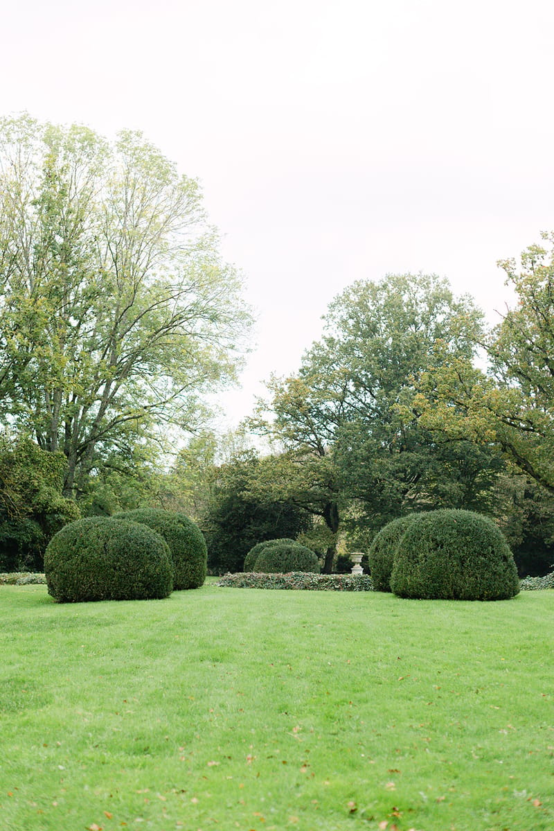 Manicured topiary balls and formal landscape gardens at Château de Méridon