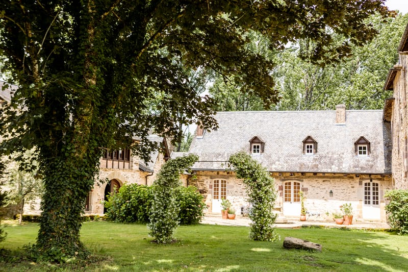 Chateau Eyparsac seen across its manicured lawns and mature trees