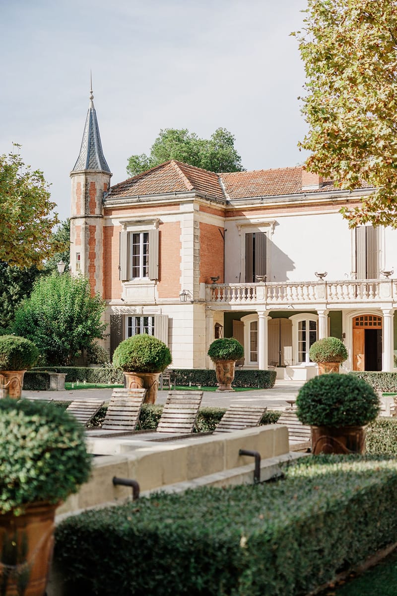 Mas D'Arvieux Provencal farmhouse exterior with tower, balustrade terrace and formal gardens