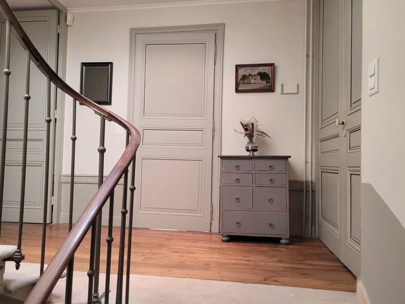 Wooden staircase and hallway inside the maison de maitre at Domaine de Vavril