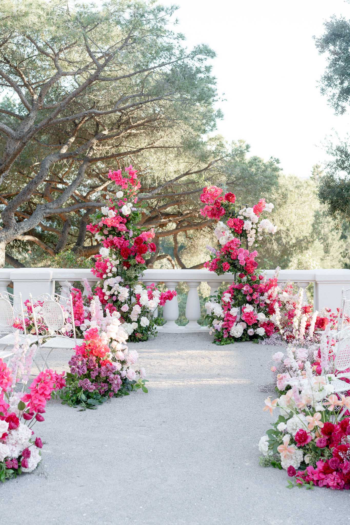 castel bay heritage story flowers ceremony aisle roses pink red white arrangement