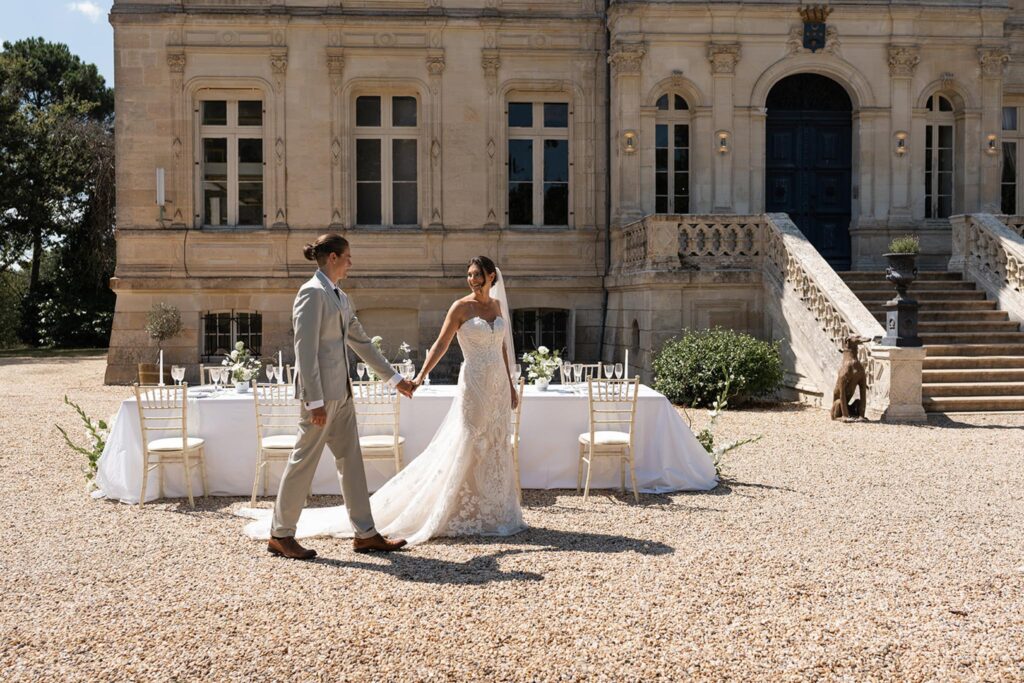 de la valouze a.bukowska bride groom holding hands walking