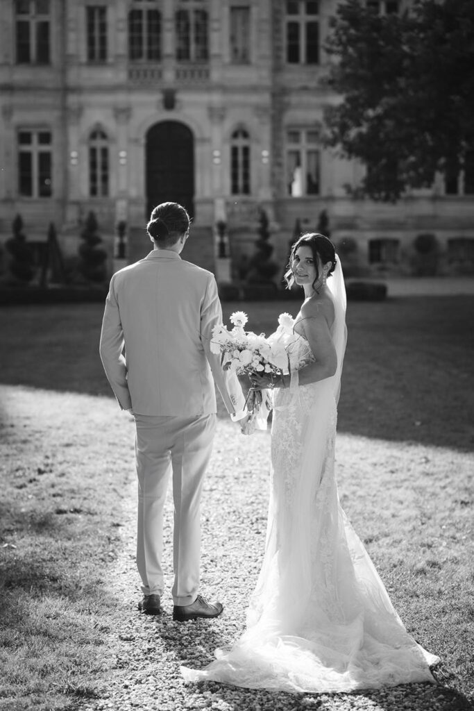 de la valouze a.bukowska bride groom looking back black white photo