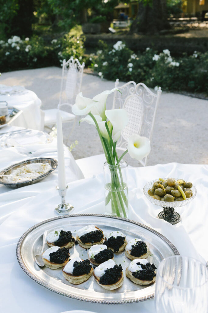 domaine de lamanon ivory romance roxane nicolas french wedding style dessert in silver tray white tulip centerpiece