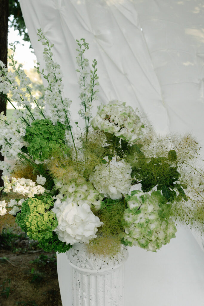 domaine de lamanon ivory romance roxane nicolas french wedding style floral arrangement vase white background