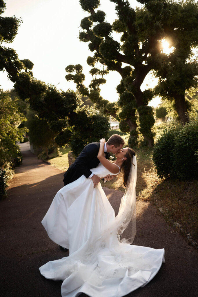 domaine du mont leuze vadim fasij french wedding style bride groom kissing sunset background