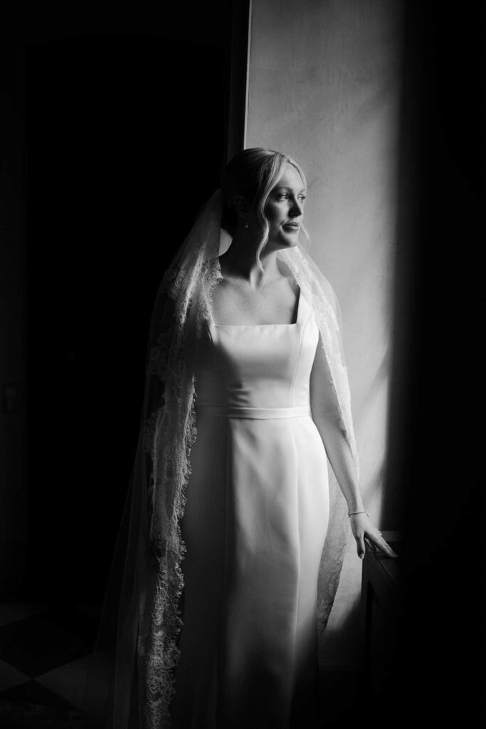 fontarech coveproduction bride beside window black white photo