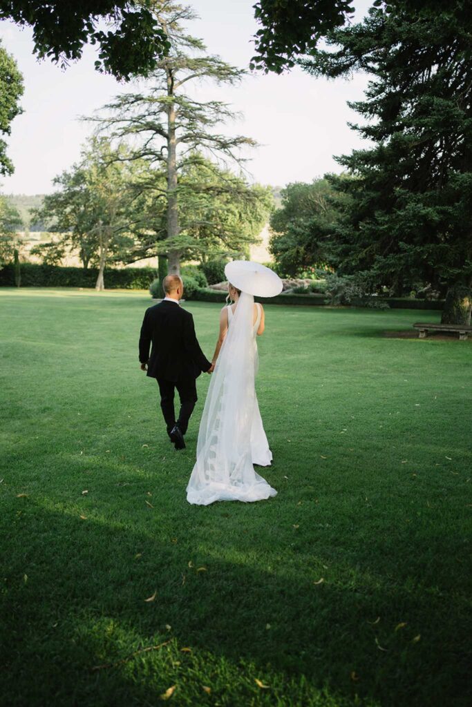 fontarech coveproduction bride groom walking back white umbrella