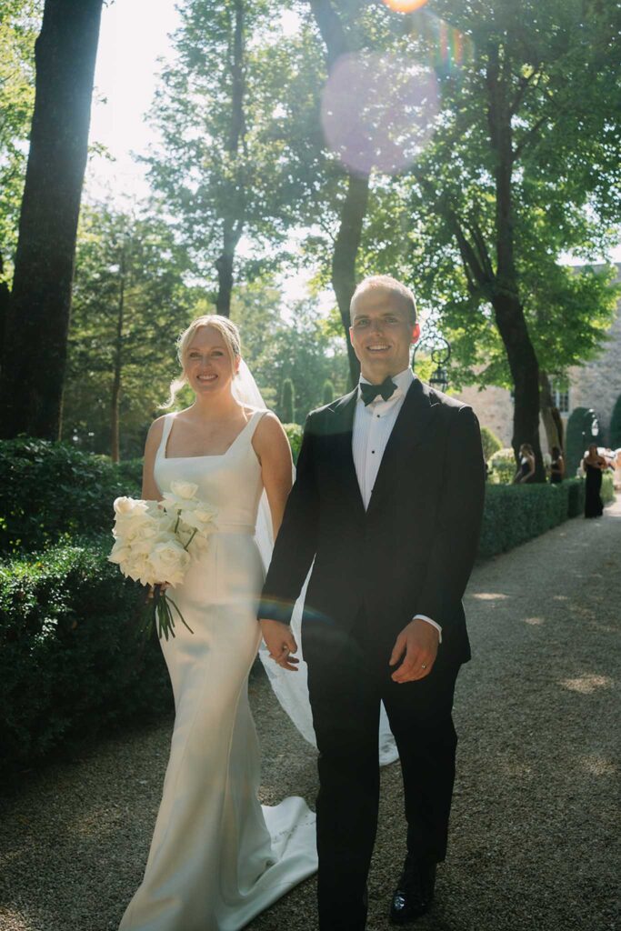 fontarech coveproduction bride groom walking holding hands white bouquet