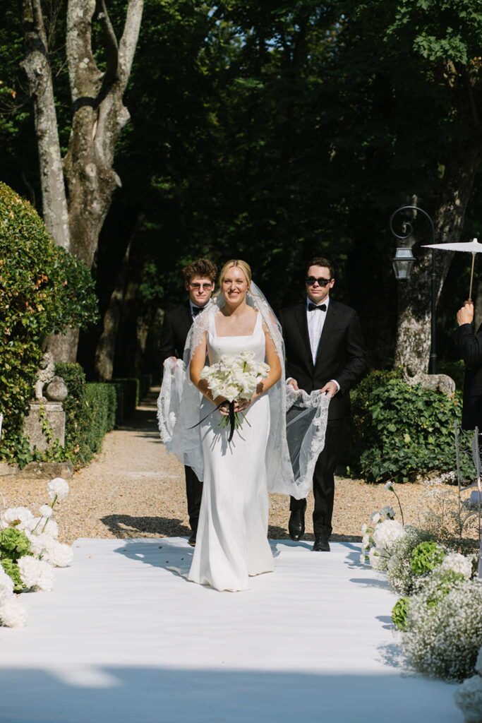 fontatech coveproduction bride walking aisle holding white bouquet