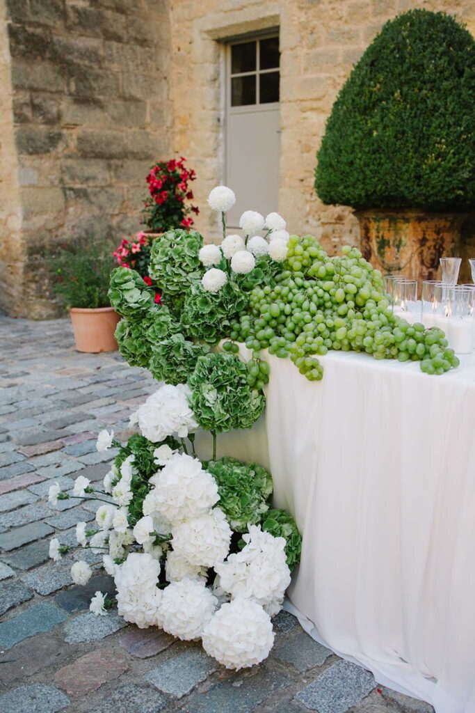 fontarech coveproduction table edge white flowers with greenery