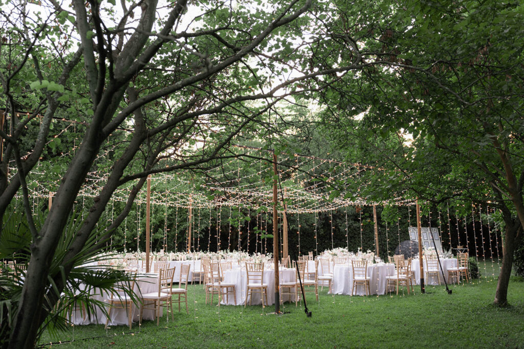 marjorie manfre country gardens french wedding style garden reception under string lights round table