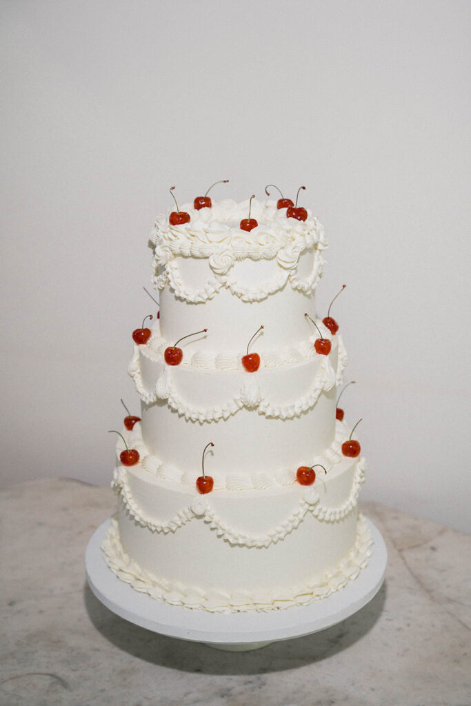 country gardens marjorie manfre french wedding style three tier wedding white cake red cherry