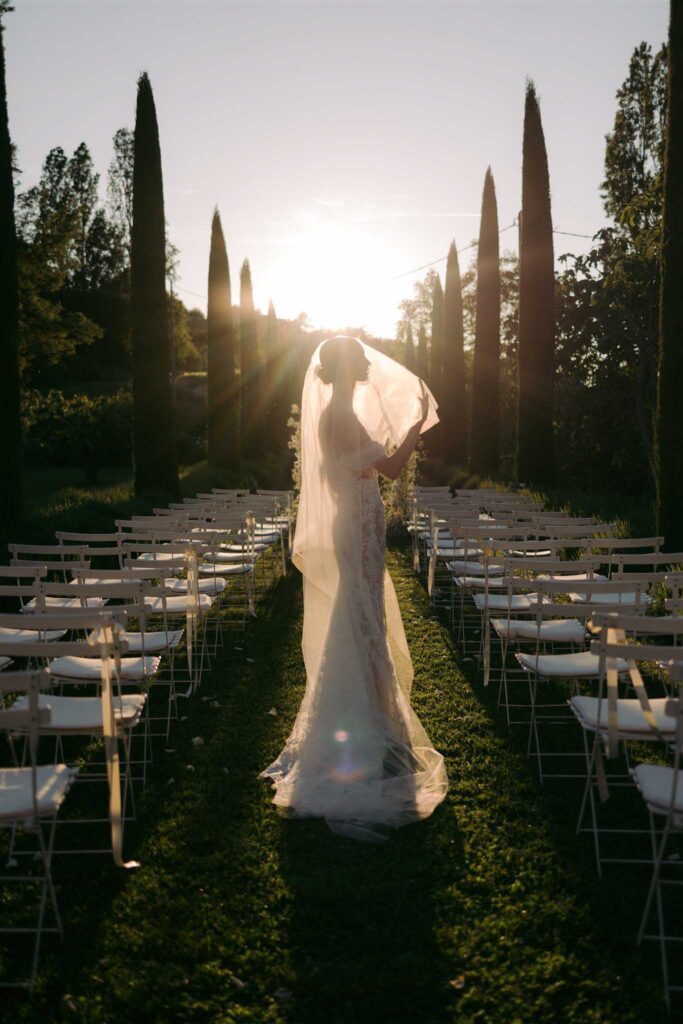 saint eusebe ayata bride middle aisle sunset shot veil