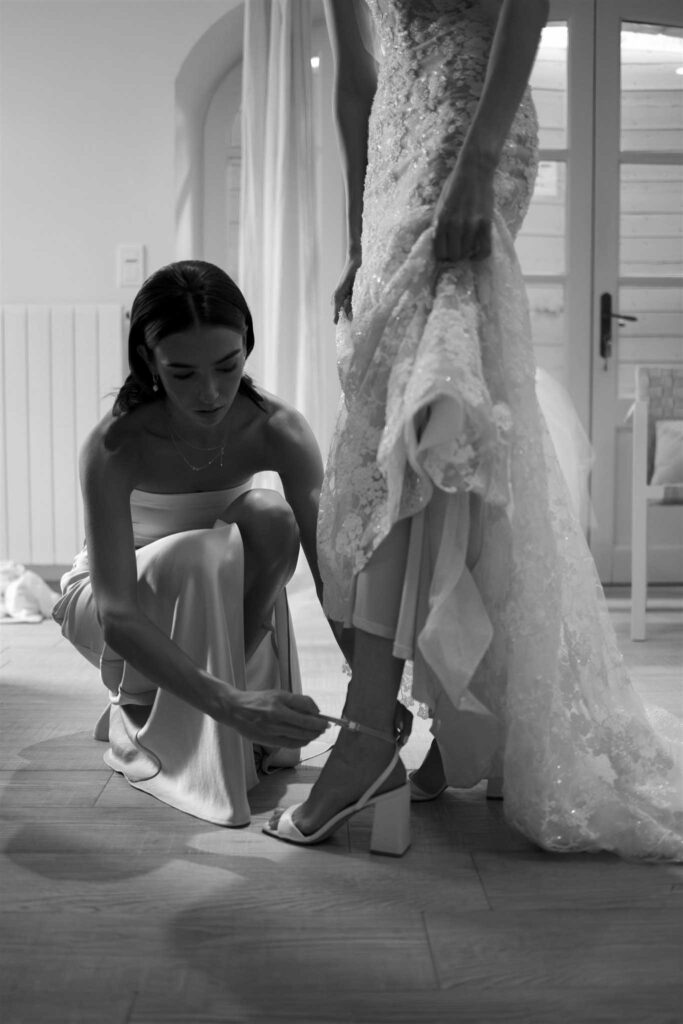 saint eusebe ayata maid of honor fixing bride shoes