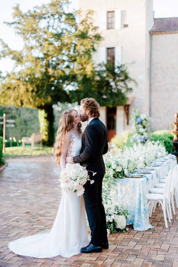 Trieux M.Mann bride groom kising reception area