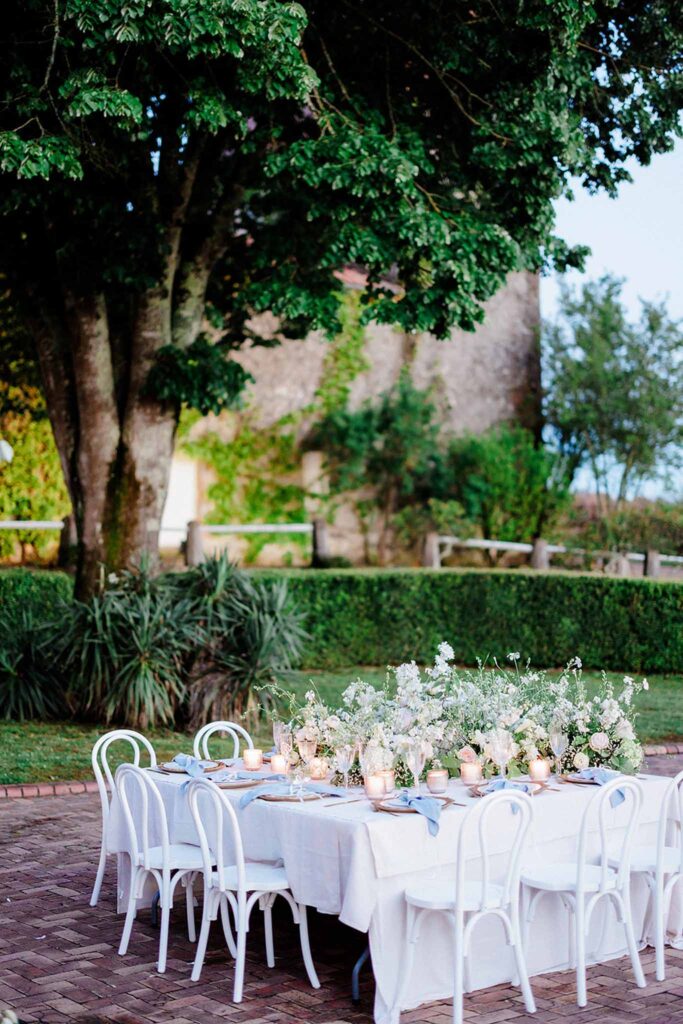 Trieux M.Mann square reception table white chairs garden