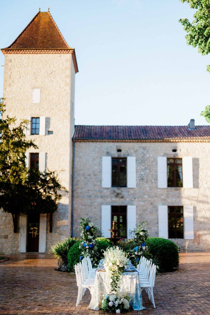 Trieux M.Mann table outside old vintage manor