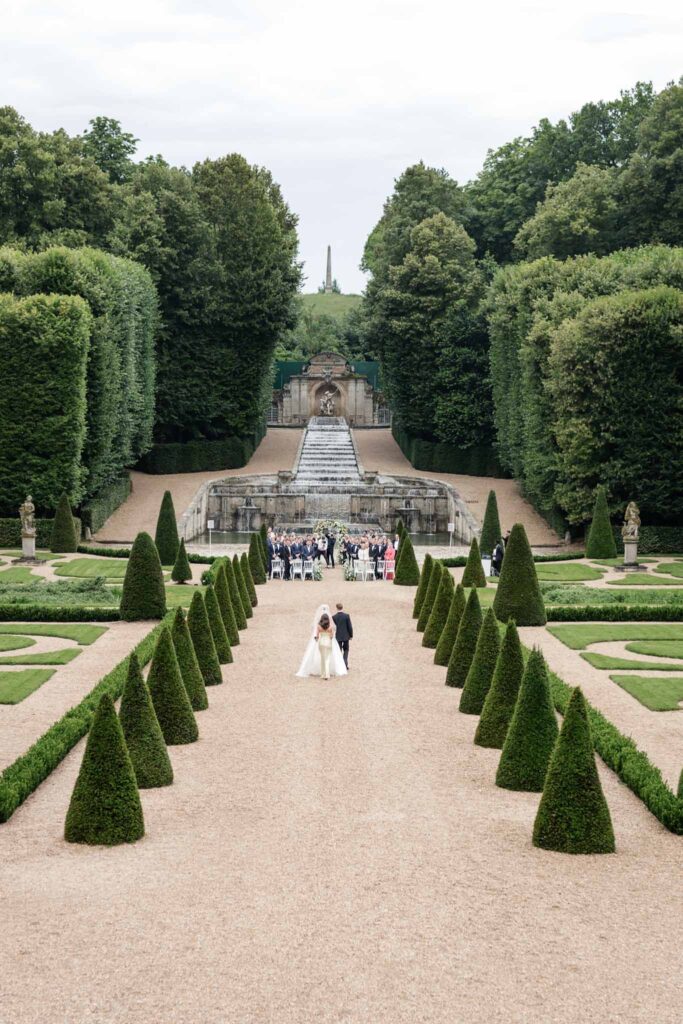 Chateau de Villette Dream Paris Wedding bride father walking towards ceremony wide shot