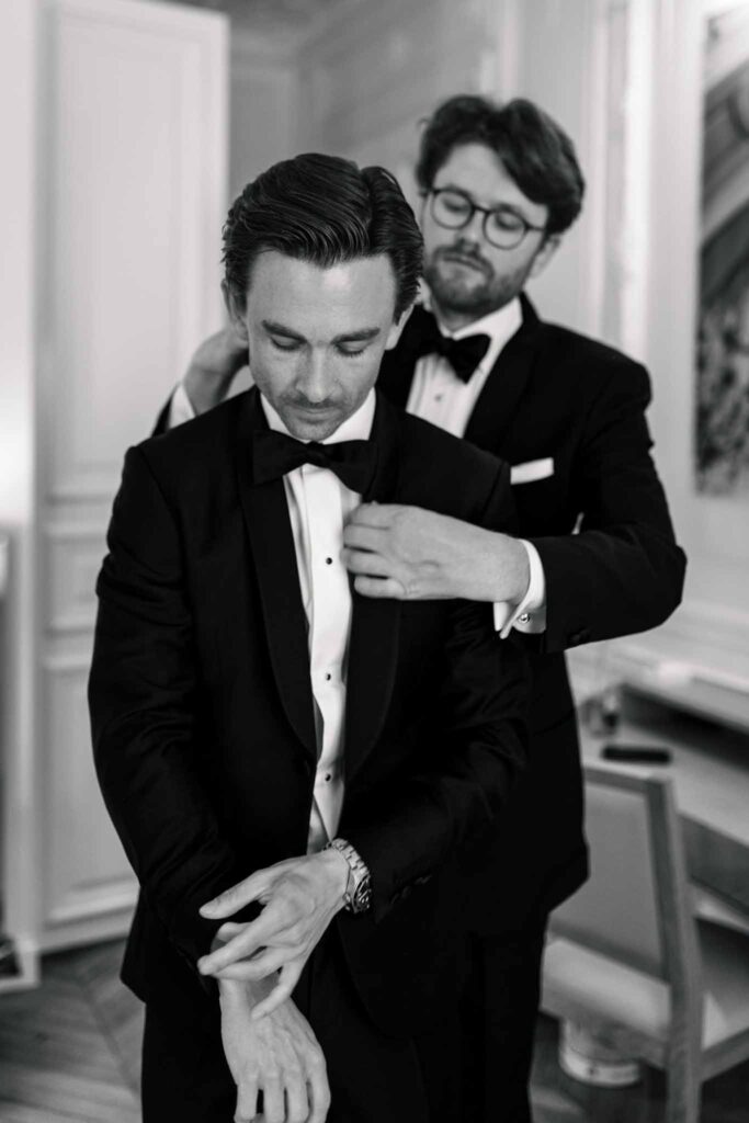 Villette Dream Paris Wedding groom bestman fixing tuxedo