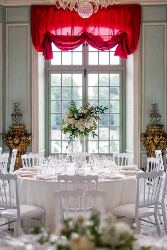 Villette Dream Paris Wedding round white table chairs red chandelier