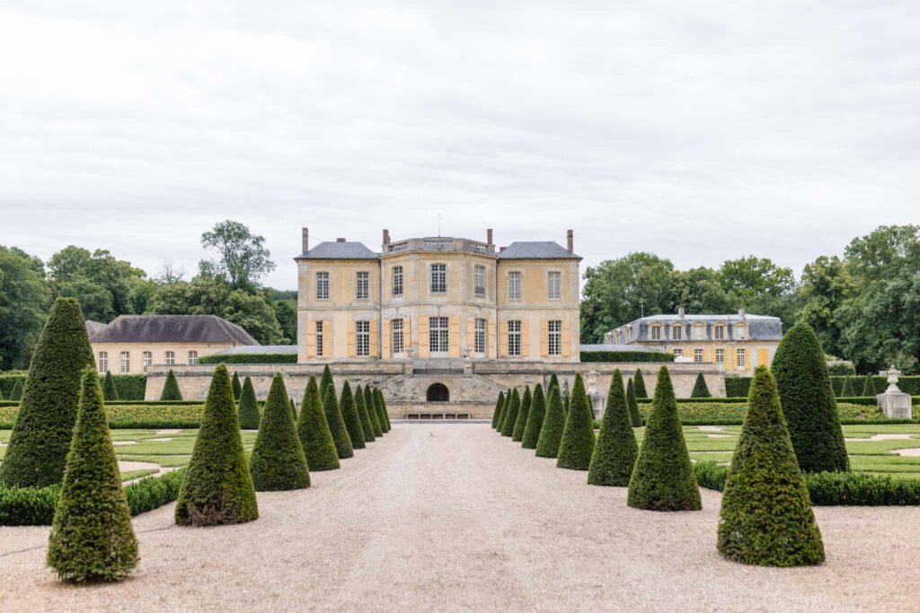 Villette Dream Paris Wedding wide shot cone shaped tress manor background