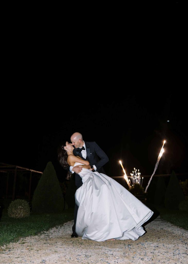 de Jalesne S.Lord bride groom kissing fireworks background