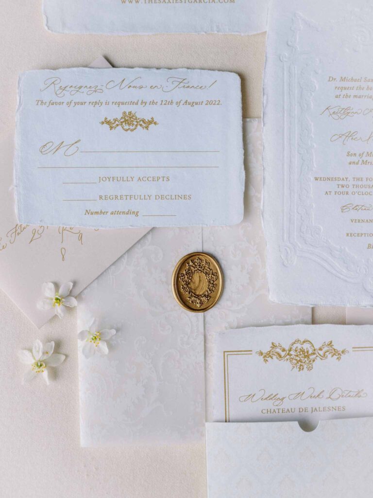 de Jalesne S.Lord flatlay invitation gold accents