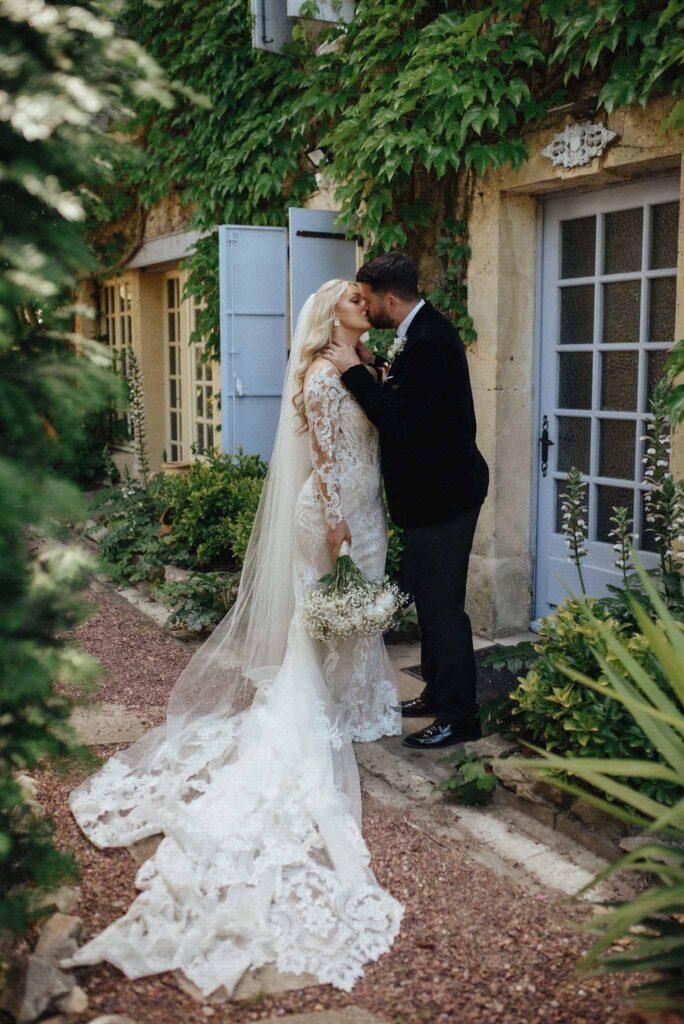  bride groom kissing pathway