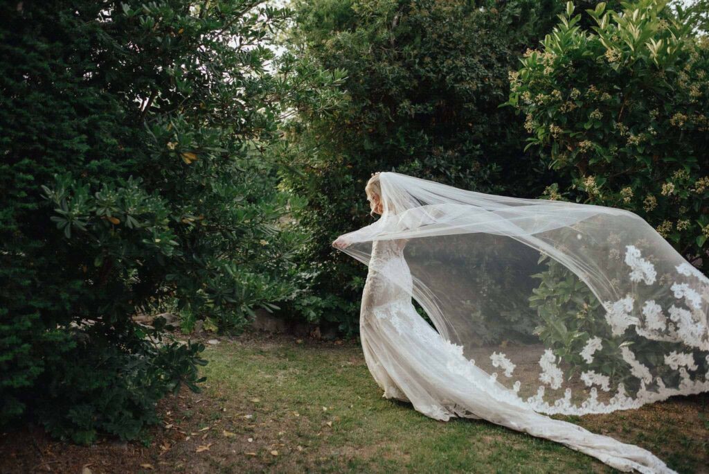 bride long flowy veil forest