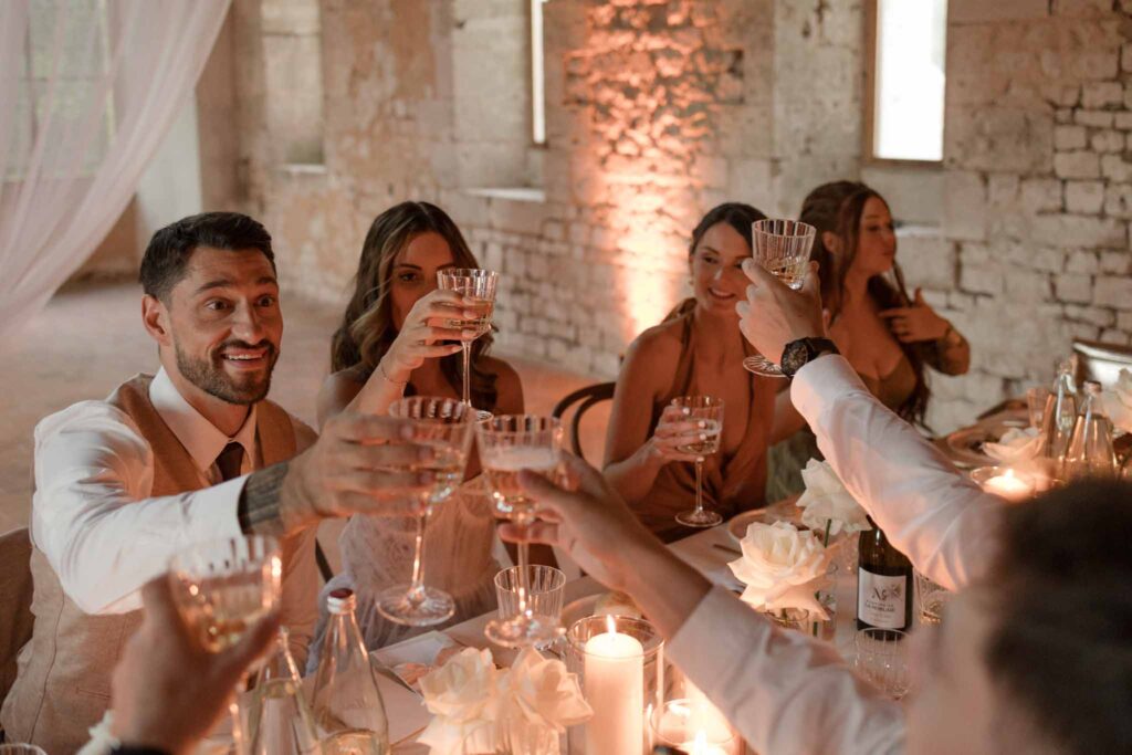 Abbaye Noce Machine bride groom guests champagne toss