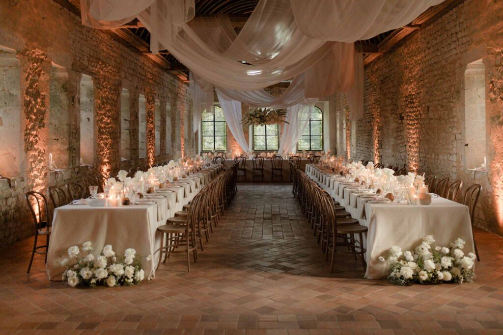 Abbaye Noce Machine long reception table inside ruined old structure u shape arrangement