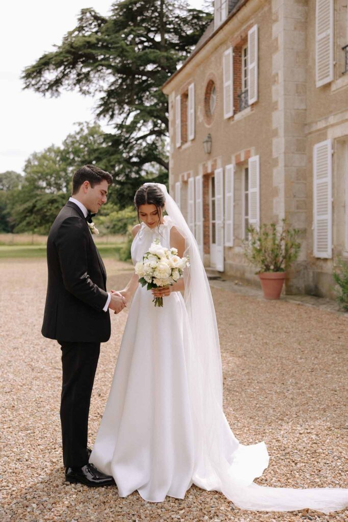 Boutonvillier F.Mary bride groom hold hands after first look