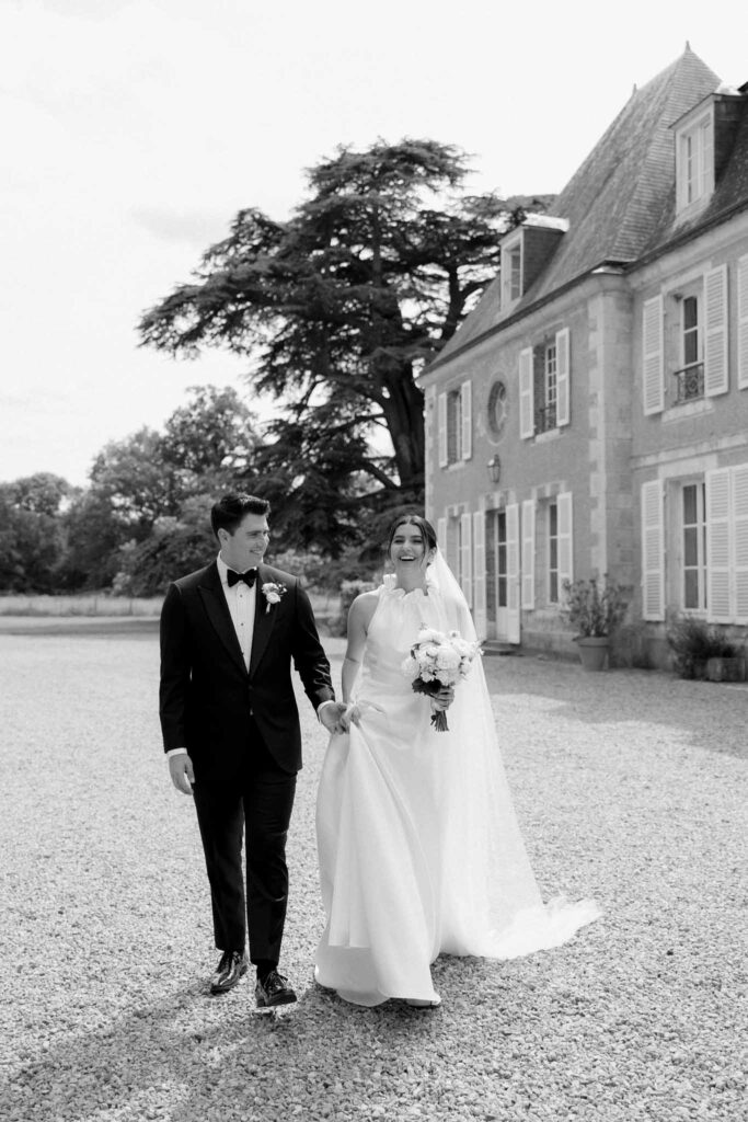 Boutonvillier F.Mary bride groom hold hands walking black white photo