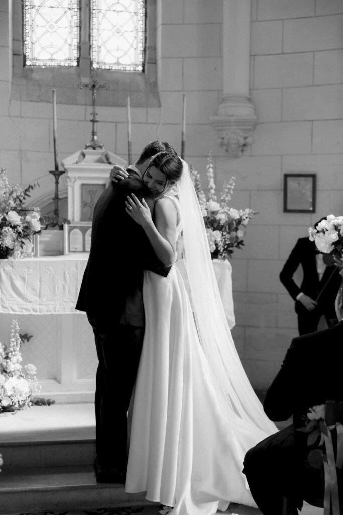 Boutonvillier F.Mary bride groom hugging altar background black white photo