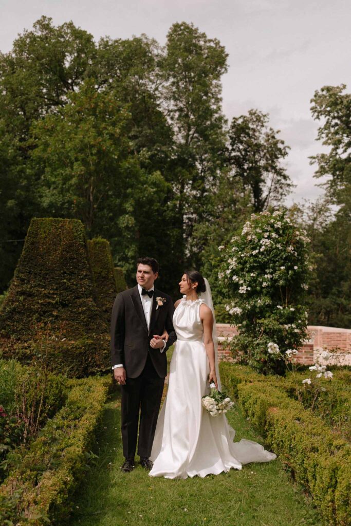 Boutonvillier F.Mary bride groom looking away shot greenery garden pathway