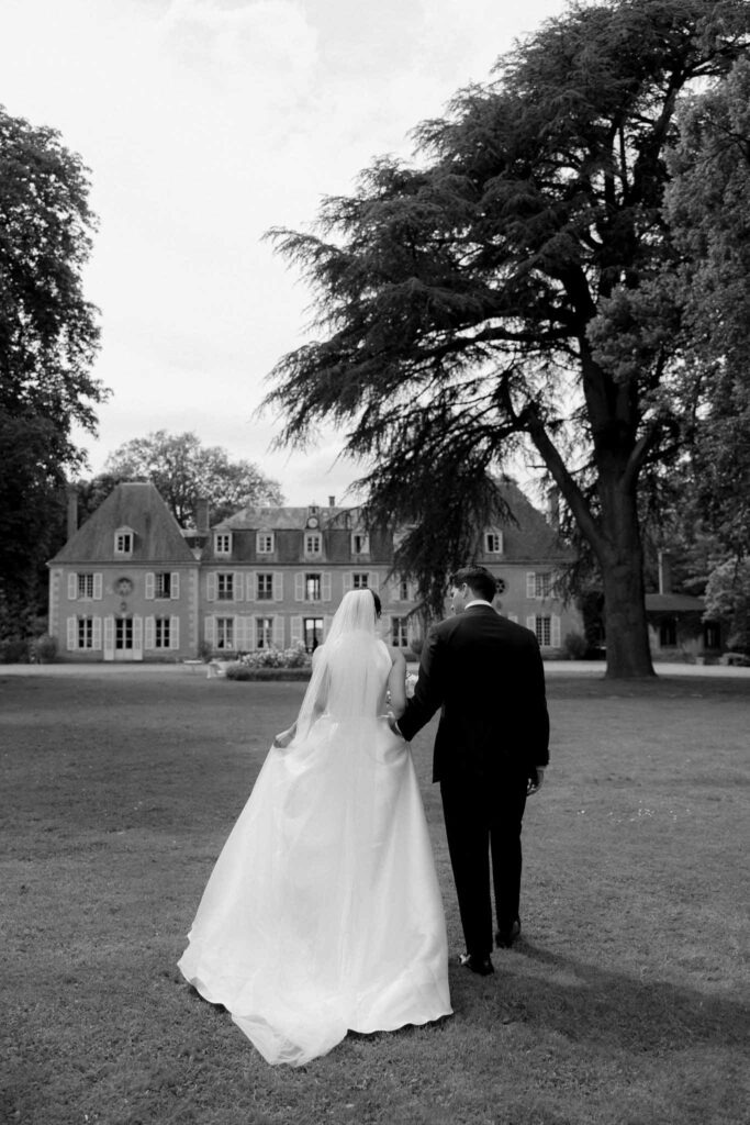 Boutonvillier F.Mary bride groom walking back shot black white photo