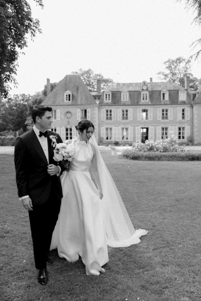 Boutonvillier F.Mary bride groom walking venue background black white photo