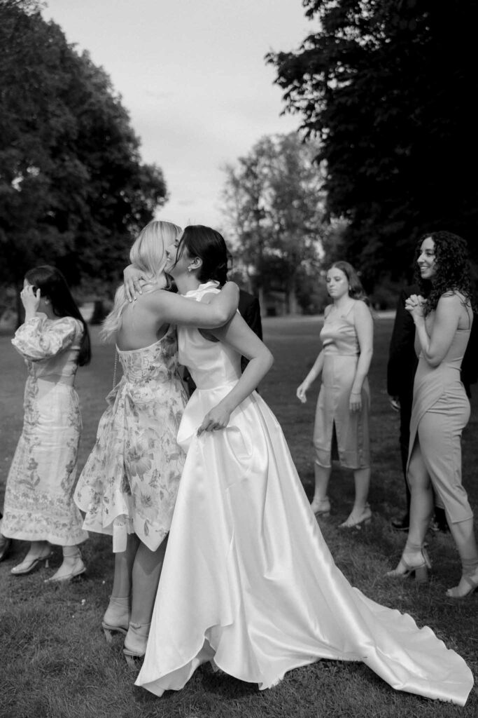 Boutonvillier F.Mary bride hugging guests black white photo