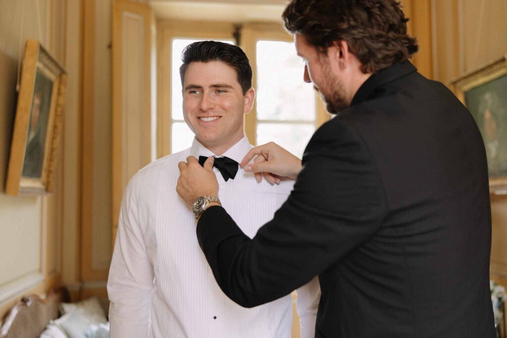 Boutonvillier F.Mary groom getting ready bestman fixing bow tie